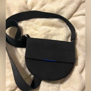 Rothy’s The Saddle Bag in Total Black.